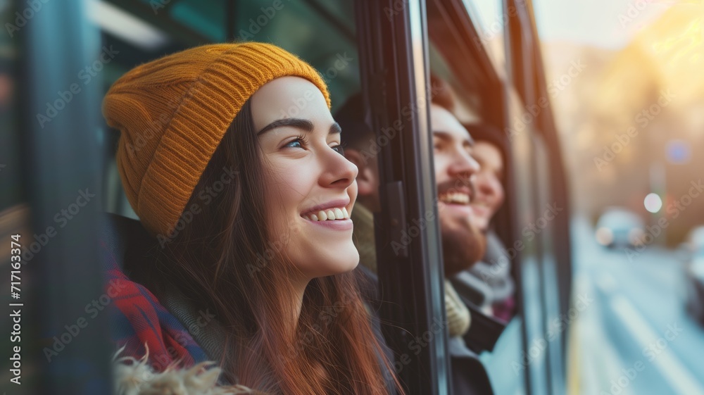 Smiling woman in a yellow beanie looking out of a bus window Smiling woman in a yellow beanie looking out of a bus window