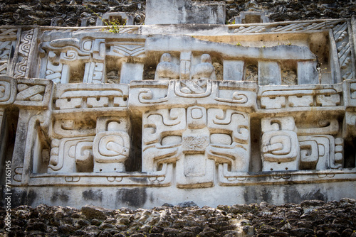 Ancient Mayan stone carvings at the XUNANTINICH (Stone Lady) Mayan Temple in Belize Central America.  photo
