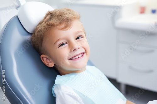 Smiling Young Boy Sitting in a Dentists Chair During a Daytime Pediatric Dental Checkup