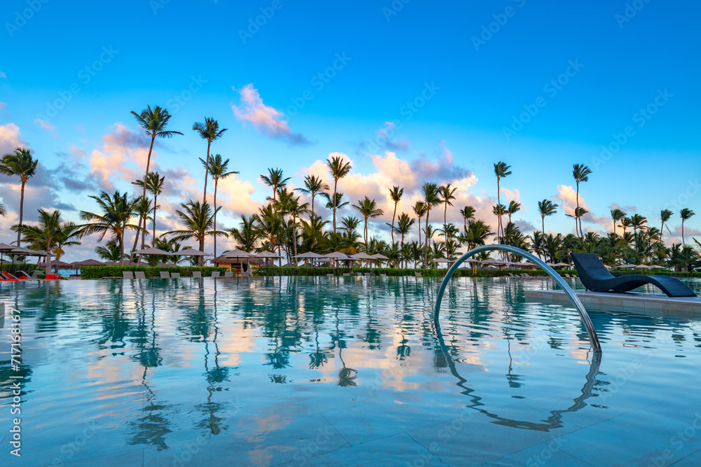 Swimming pool and palm trees in luxury resort at Pun Cana in the Dominican Republic