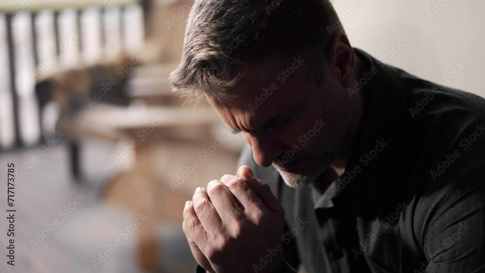 Adult man folded his palms and prays. Happy father clasped two arms and dreaming about second child in family. Young religious dad believe in gods justice Adult man folded his palms and prays. Happy father clasped two arms and dreaming about second child in family. Young religious dad believe in gods justice