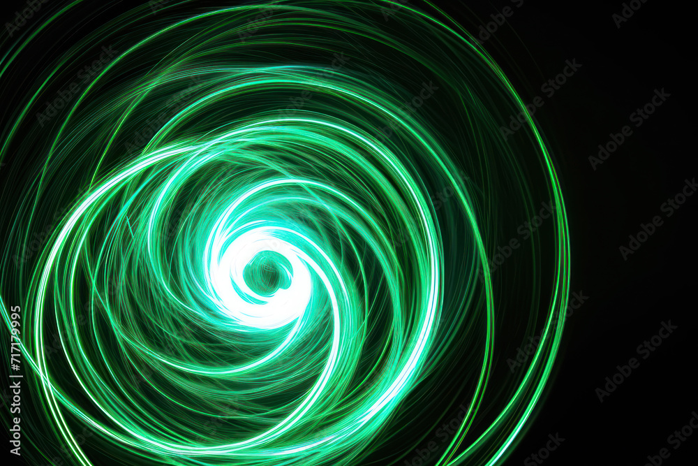 A beautiful, bright light swirl of green color. Futuristic light painting on a black background. Round light circles