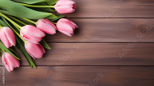  Pink tulips on wooden background with copy space.