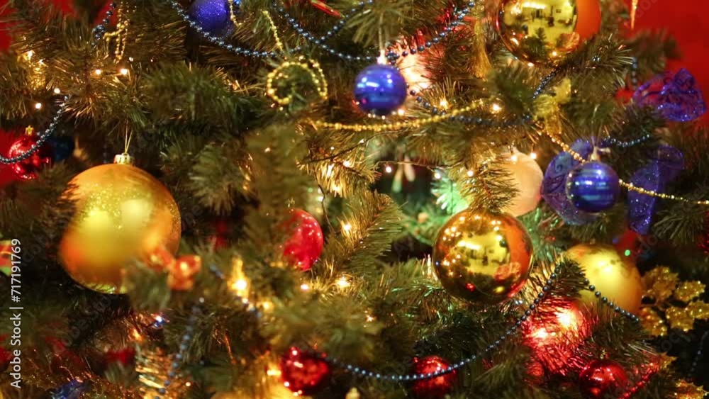 Close up of bright Christmas tree with shiny balls and illumination Close up of bright Christmas tree with shiny balls and illumination