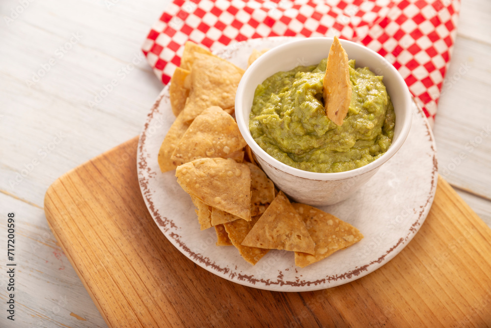 Guacamole. Avocado dip sauce, one of its many ways of consuming it is spread on tortilla chips also called Nachos. Mexican easy homemade sauce recipe very popular. Guacamole. Avocado dip sauce, one of its many ways of consuming it is spread on tortilla chips also called Nachos. Mexican easy homemade sauce recipe very popular.
