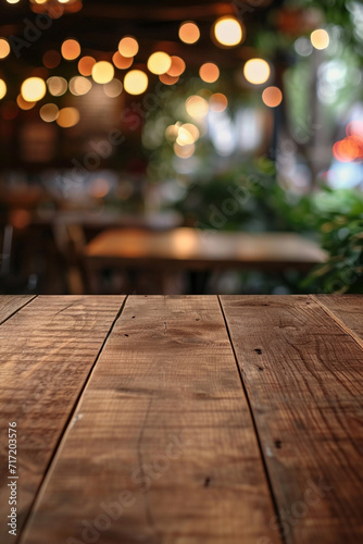 wood table on blur of cafe, coffee shop, bar, background - can used for display or montage.