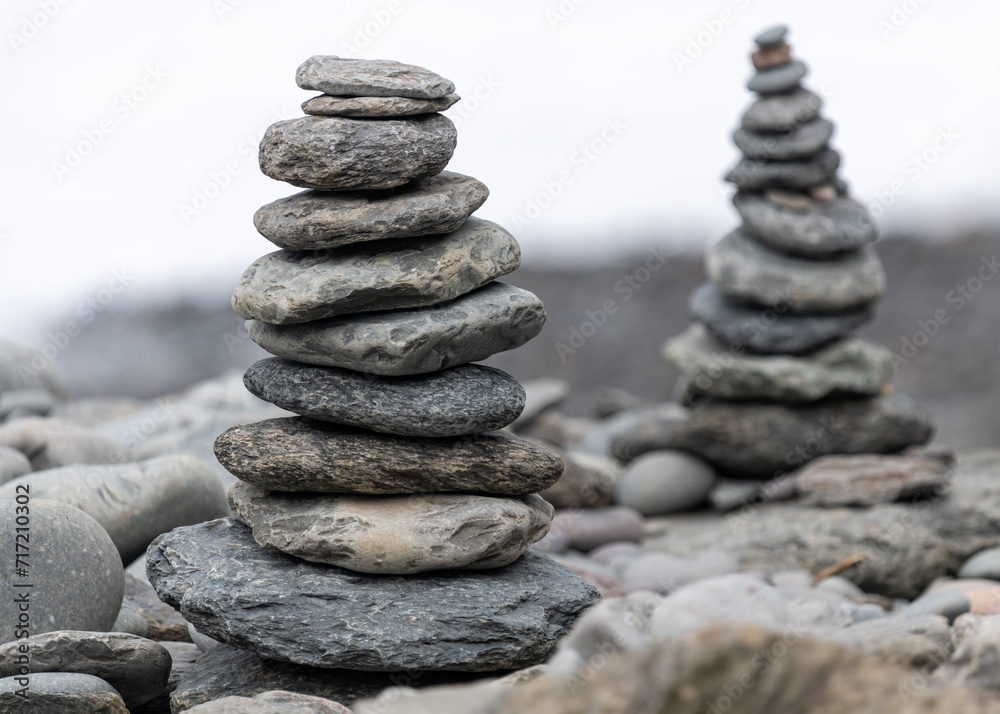 Close up of pebbles stacked on on a rocky beach