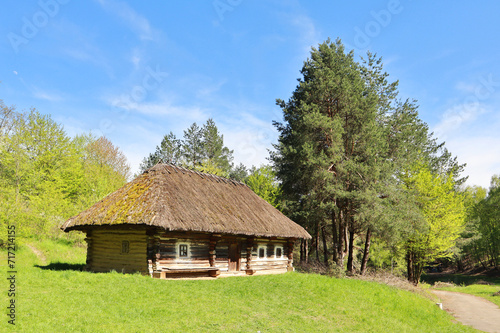 Traditional Ukrainian wooden house in Pirogovo, Ukraine © Lindasky76