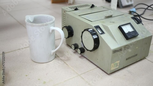 Device for chemical analysis and flasks on desk in lab photo