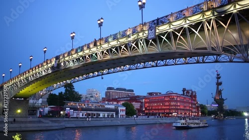 Patriarchal Bridge over Moscow river and ship floating on it from monument