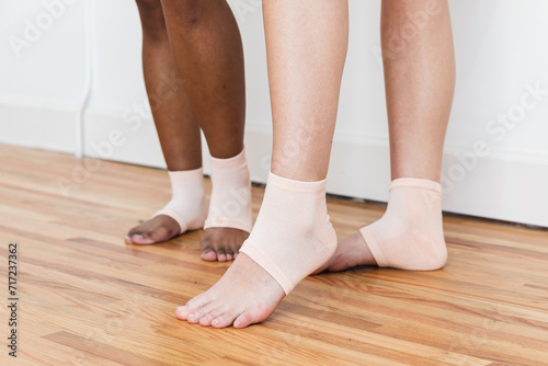 Woman wearing gel heel treatment socks © Deidre