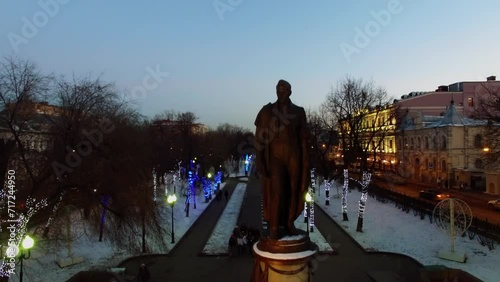 People walk near monument of A.S.Griboedov on Chistoprudniy boulevard photo