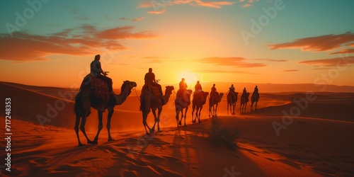 Group of People Riding Camels Across Desert