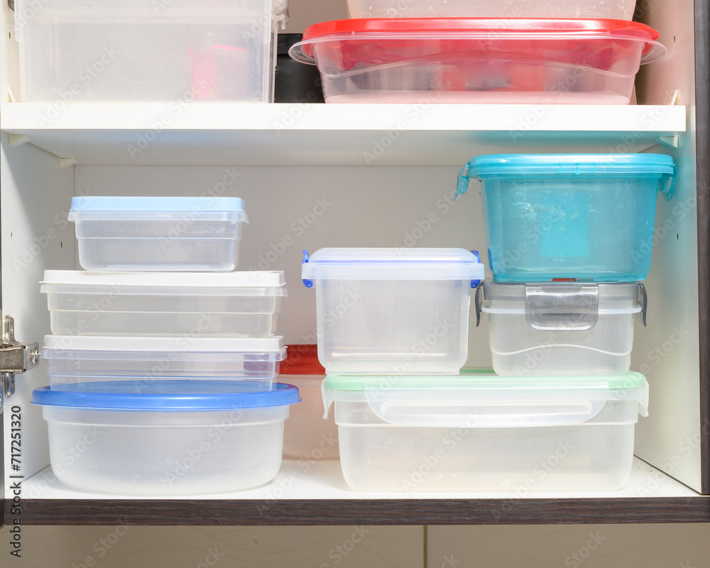 plastic food containers arranged neatly in a kitchen cabinet plastic food containers arranged neatly in a kitchen cabinet