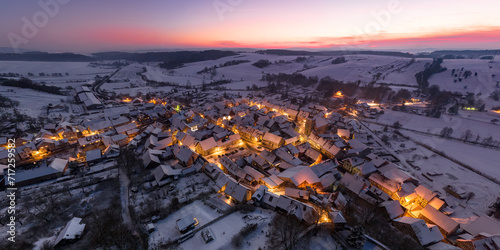 Aerial view of snowy Ummerstadt in Thuringia, Germany at Dusk