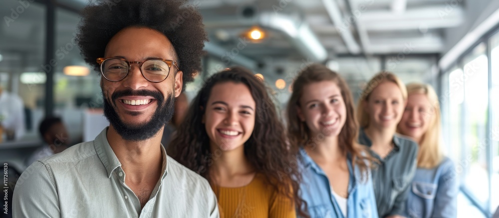 Happy colleagues smiling together in an office, representing diversity and teamwork in the corporate workforce. Happy colleagues smiling together in an office, representing diversity and teamwork in the corporate workforce.