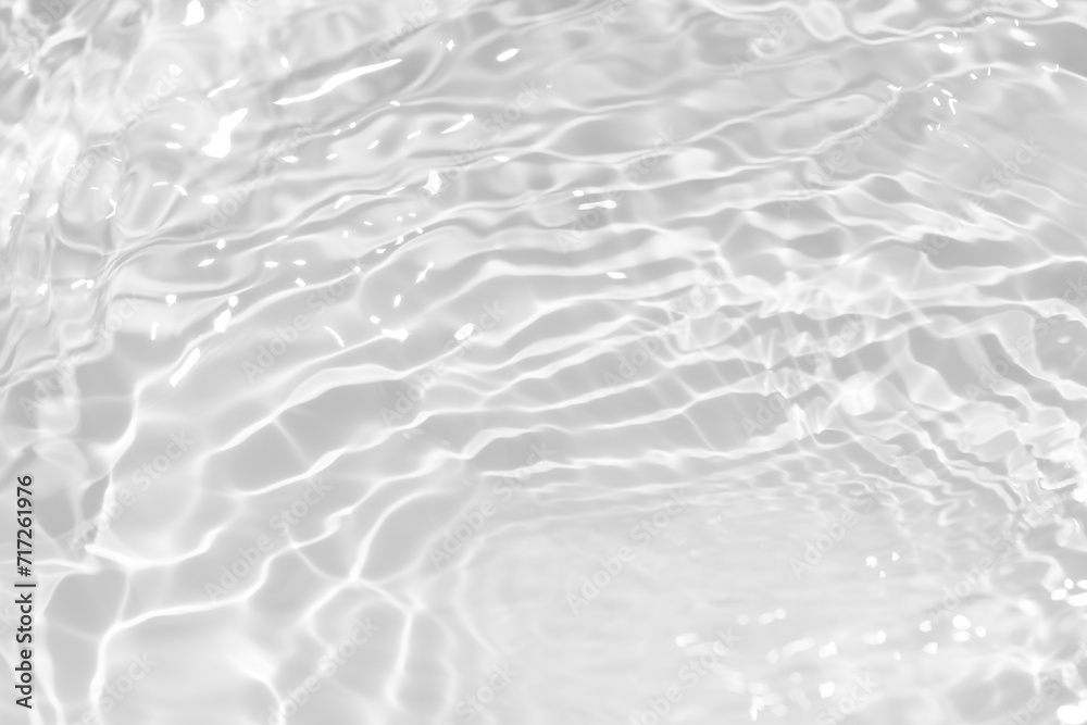 White water with ripples on the surface. Defocus blurred transparent white colored clear calm water surface texture with splashes and bubbles. Water waves with shining pattern texture background. White water with ripples on the surface. Defocus blurred transparent white colored clear calm water surface texture with splashes and bubbles. Water waves with shining pattern texture background.
