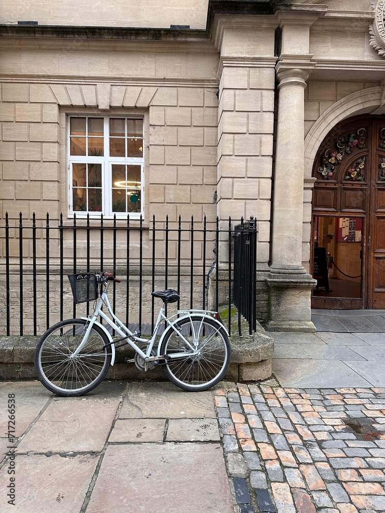 Vintage bicycle parked in front of house entrance
