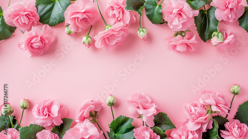 A border of light pink begonias on a harmonious pink background, creating a subtle frame, Valentine's Day, Flat lay, top view, with copy space © Катерина Євтехова