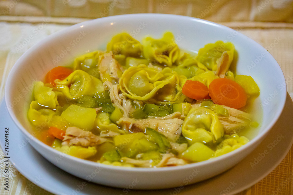 Traditional capeletti soup with chicken and vegetables. Typical winter dinner soup Traditional capeletti soup with chicken and vegetables. Typical winter dinner soup