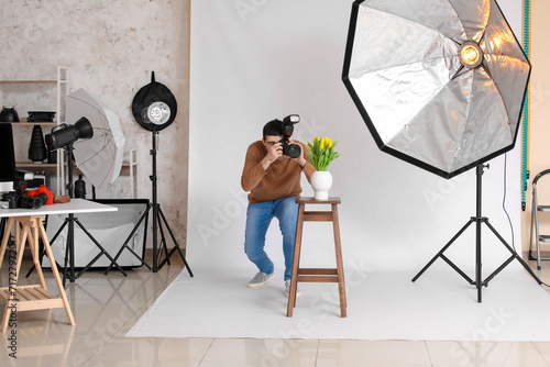 Young male photographer tak...