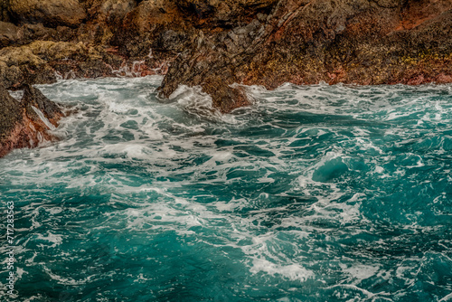 Blue Ocean Waves Crashing on the Volcanic Coast in Madeira island, Portugal