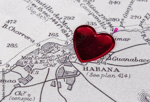 An old black and white navigational paper chart of the port and city of Havana, Cuba with a red heart pinned on it