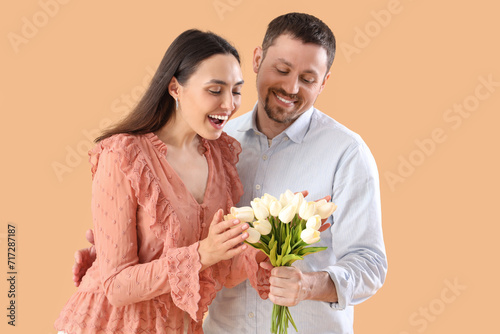 Happy young couple with tul...