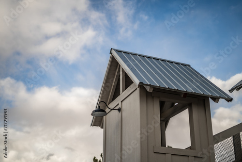Rooftops Small Building With Lamp Light Partially Cloudy Blue Sky