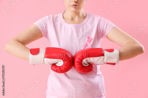 Young woman in boxing glove...