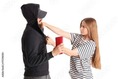 Robber trying to steal wallet from young woman on white background. Concept of self-defence