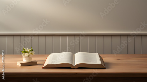 Book on a table with a plant near by
