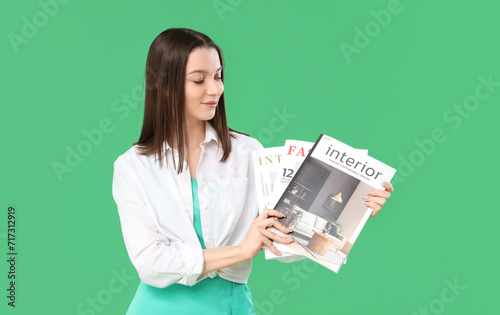Young woman with magazines ...
