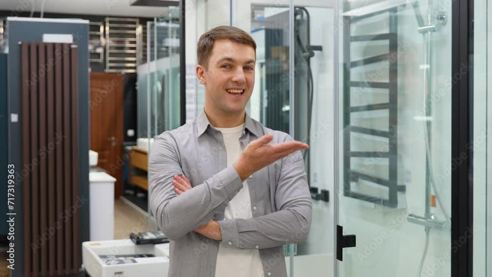 Portrait of a man near shower cabin in a store Portrait of a man near shower cabin in a store