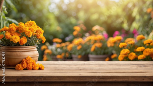 Empty wooden table for product display with marigold garden background
