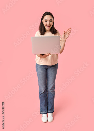 Pretty young woman with lap...