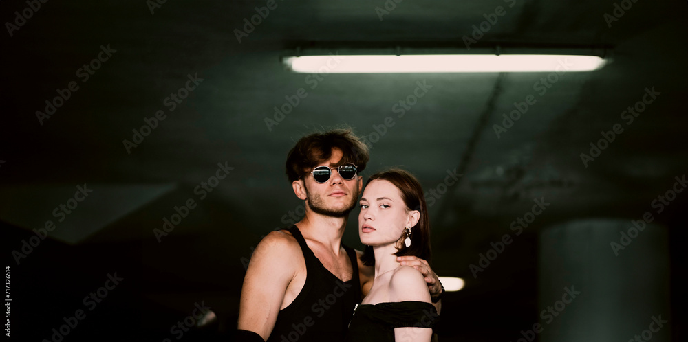young couple of beautiful people in love hugging in the city on a date in summer, urban style. young couple of beautiful people in love hugging in the city on a date in summer, urban style.