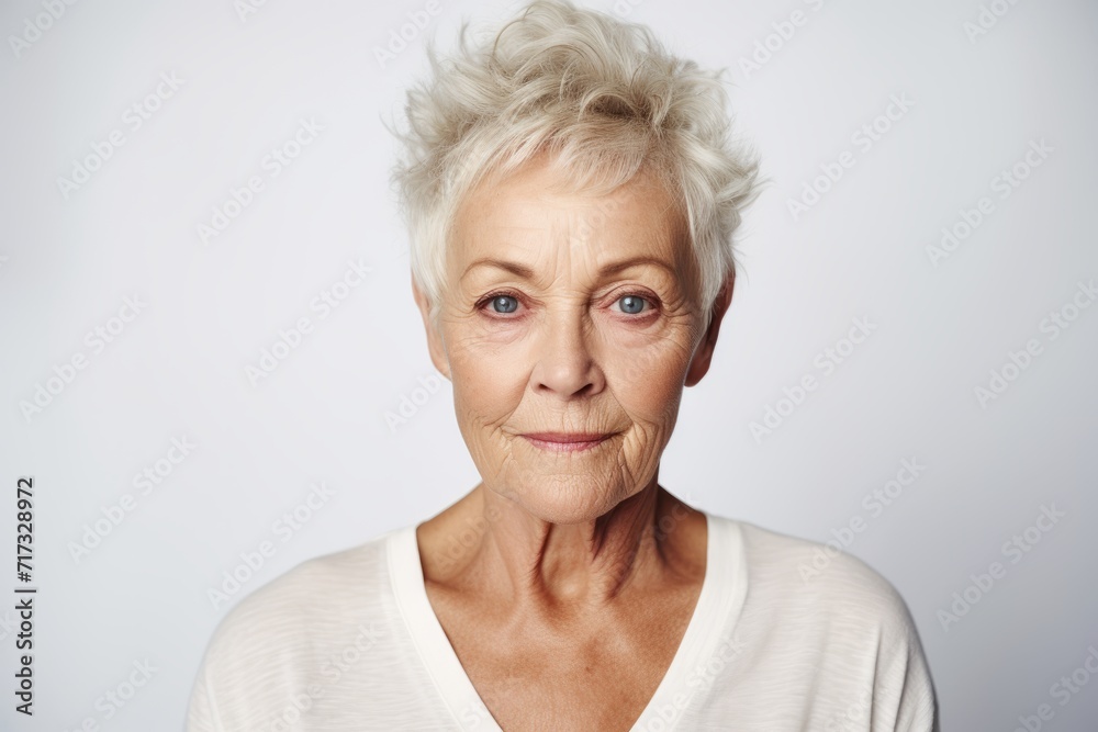 Portrait of senior woman with wrinkles on her face looking at camera