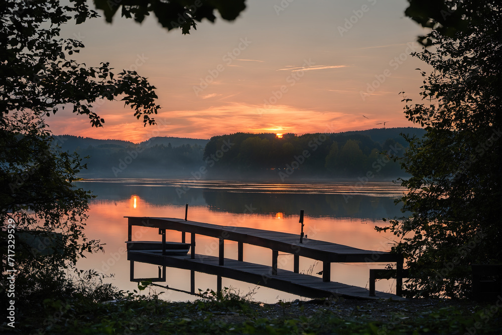 Beautiful lakeside and dock wooden boats at early morning sunrise