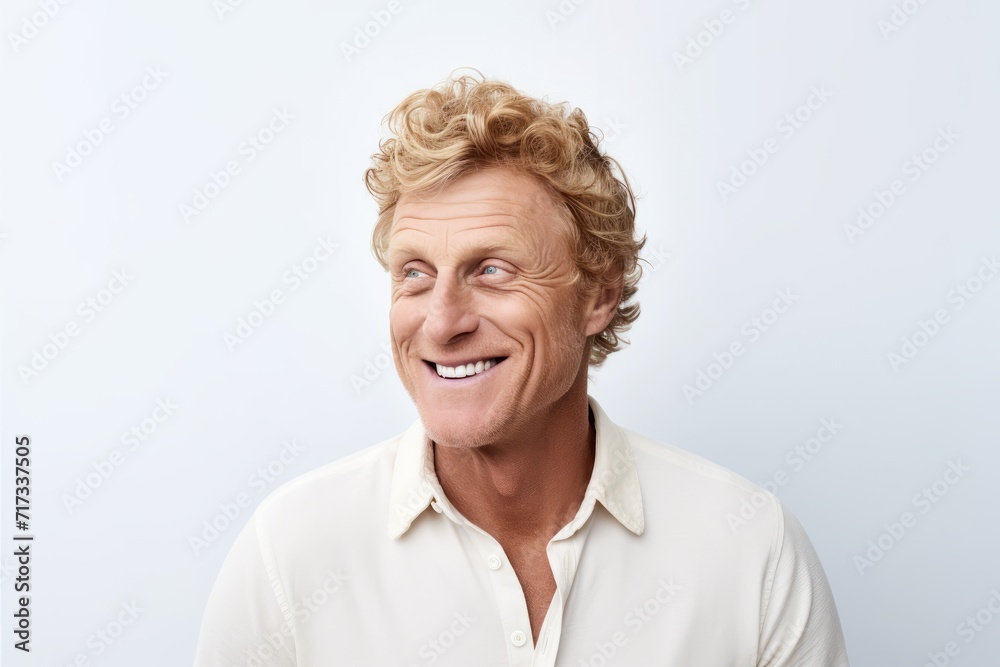 Portrait of a happy senior man smiling against a white background. Portrait of a happy senior man smiling against a white background.