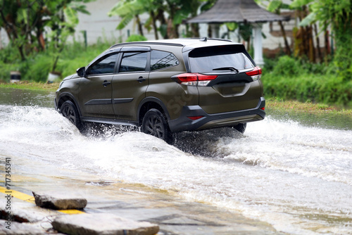 driving in puddles or flooded roads. driving risks aqua planing.