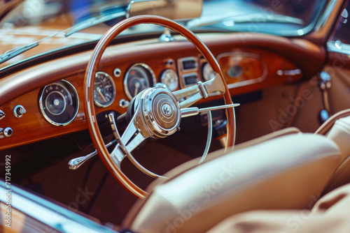 Wooden and steel steering wheel in luxury retro cabriolet car with beige leather interior. © Hunman