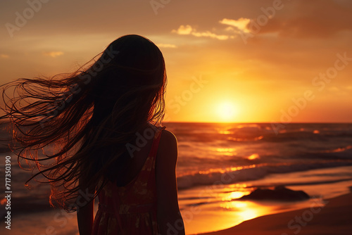 Generative AI Image of Little Girl Standing on the Beach at Sunset © heartiny