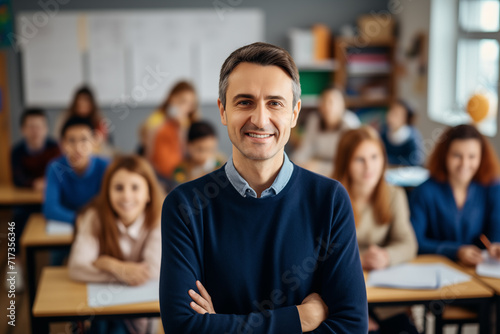 Portrait of smiling male teacher in a class at elementary school looking at camera with learning students on background. Generative AI