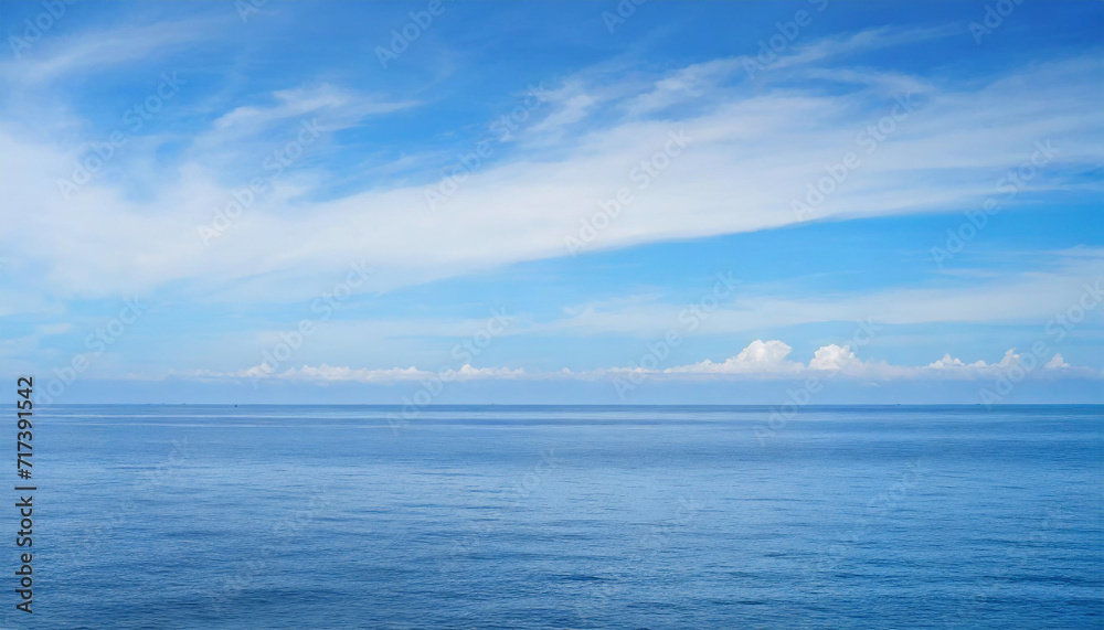 Tranquil Seascape under a Clear Blue Sky with Fluffy Clouds on a Sunny Summer Day