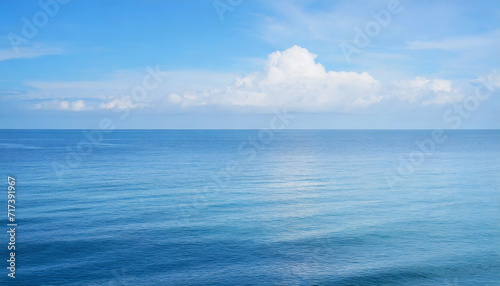 Tranquil Seascape under a Clear Blue Sky with Fluffy Clouds on a Sunny Summer Day