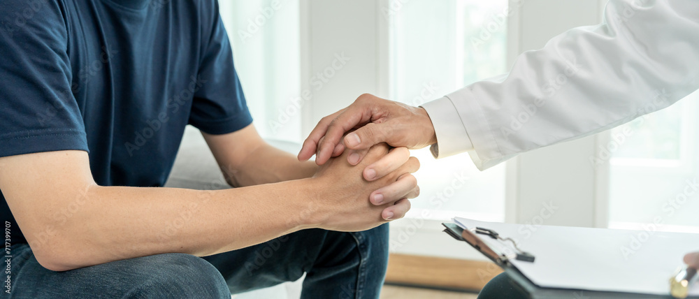 psychiatrist hold hand support each while discussing family issues. doctor encourages and empathy man suffers depression. psychological, save divorce, Hand in hand together, trust, care psychiatrist hold hand support each while discussing family issues. doctor encourages and empathy man suffers depression. psychological, save divorce, Hand in hand together, trust, care