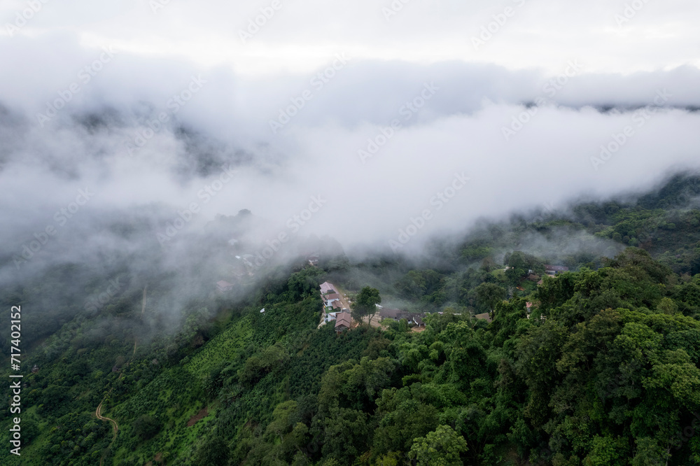 Top view Landscape of Morning Mist with Mountain Layer at north of Thailand. mountain ridge and clouds in rural jungle bush forest