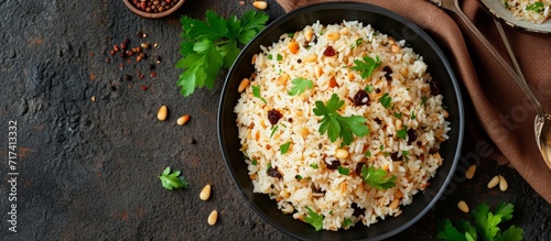 Turkish dish, rice pilaf with pine nuts and currants, known as bademli ic pilav or pilaf.