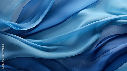 Abstract Fabric Waves invites you into a world of mesmerizing textile artistry, where shadow and light engage in a dance upon the rippling surface of blue fabric. This unique and captivating compositi